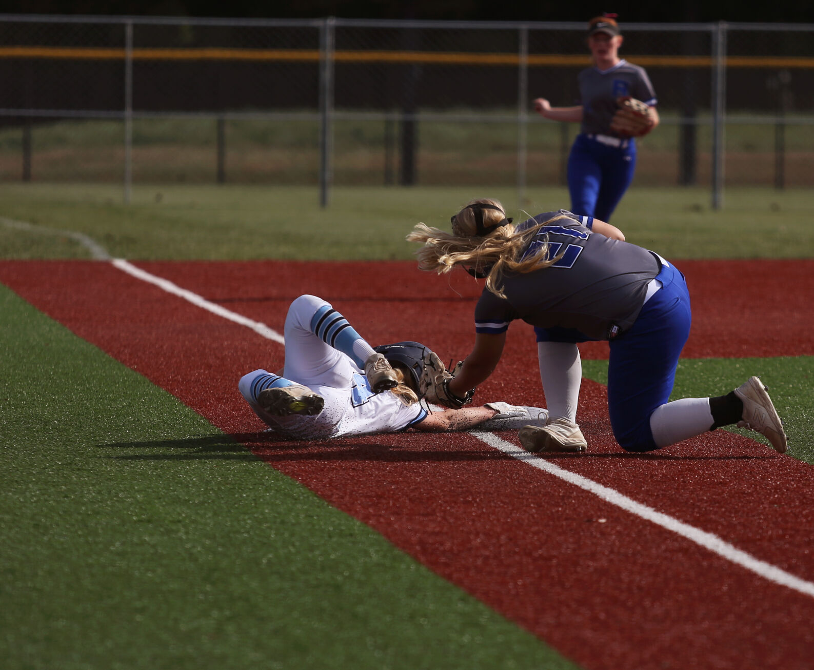 Tolton junior Sophie Angel gets tagged out on third base